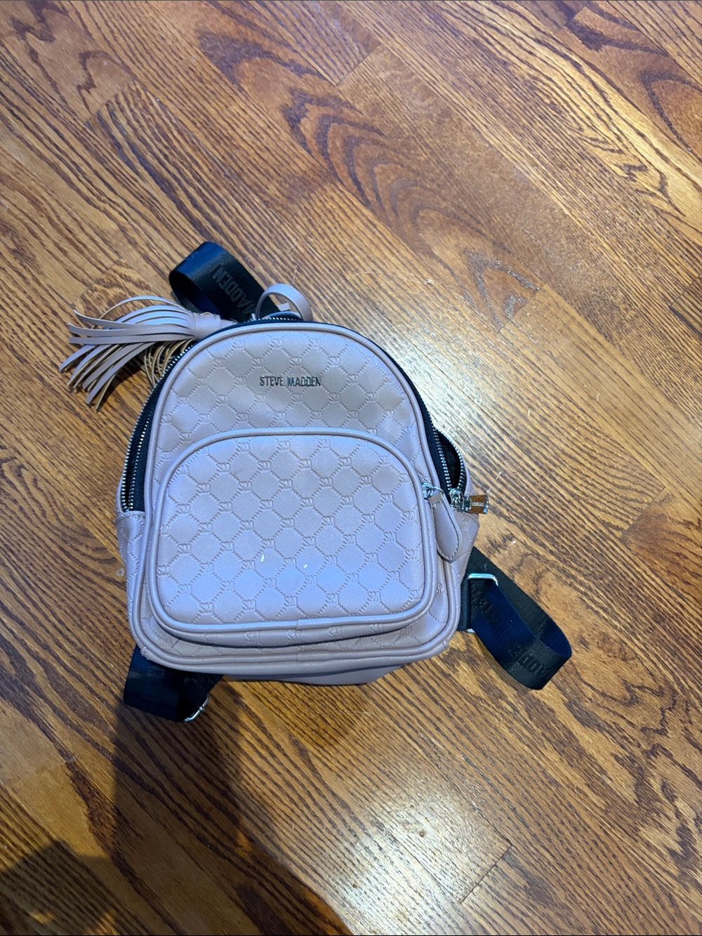 Steve Madden Light Blush Quilted Mini Backpack with Tassel